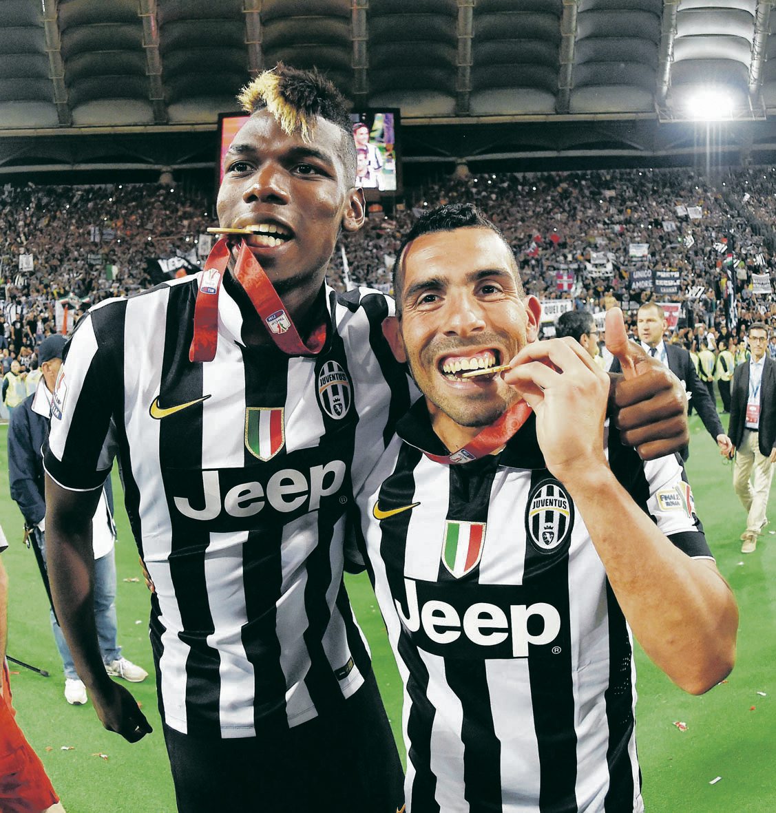 ROME, ITALY - MAY 20: Paul Pogba and Carlos Tevez of Juventus celebrate the victory after the TIM Cup final match between SS Lazio and Juventus FC at Olimpico Stadium on May 20, 2015 in Rome, Italy. (Photo by Giuseppe Bellini/Getty Images) (Giuseppe Bellini) ROME, ITALY - MAY 20: Paul Pogba and Carlos Tevez of Juventus celebrate the victory after the TIM Cup final match between SS Lazio and Juventus FC at Olimpico Stadium on May 20, 2015 in Rome, Italy. (Photo by Giuseppe Bellini/Getty Images) (Giuseppe Bellini)