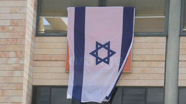 Israeli flag covering Orange logo during controversy (Photo: Ido Erez)