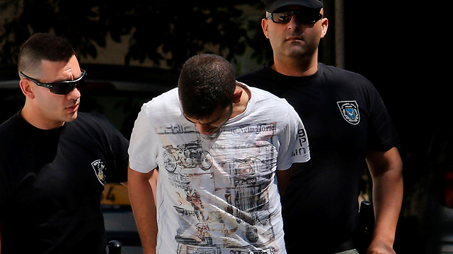 A 26-year-old Lebanese-Canadian man is escorted to court by the police in Larnaca, Cyprus (Photo: Reuters)