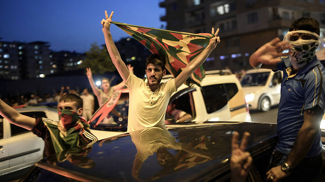HDP supporters celebrate the early results on Sunday night. (Photo: AFP) (Photo: AFP)