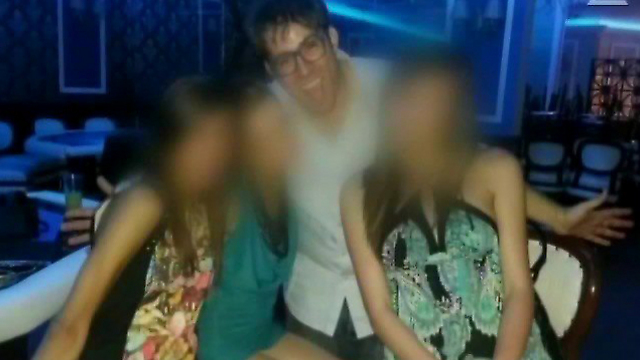 Hazan allegedly in the company of escorts at a Bulgaria casino.