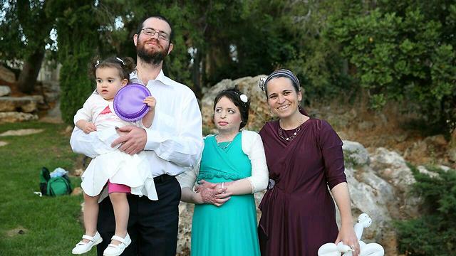Ayla with her parents and one of her sisters at her Bat Mitzvah (Photo: Moti Yair)