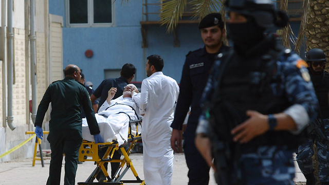 A wounded man evacuated from the scene of the attack. (Photo: AFP) (Photo: AFP)