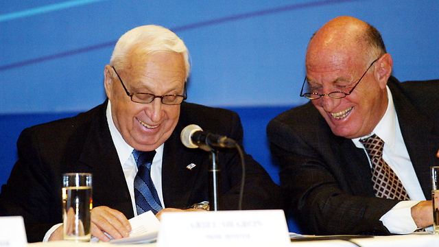 Sharon with his chief of staff Dov Weissglass (Photo: Atta Awisat)