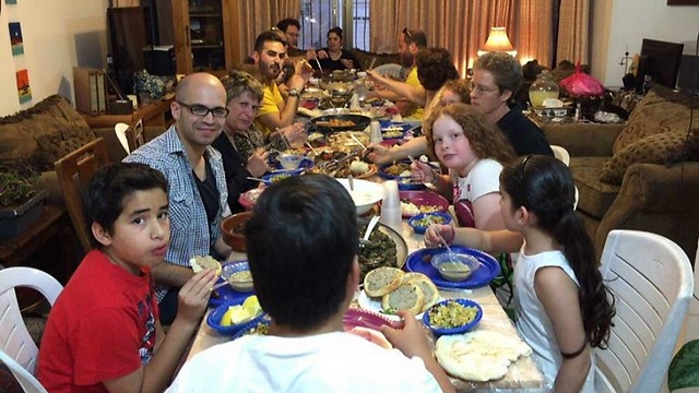 Jews and Muslims sit together for an iftar meal in Jerusalem (Photo: Linda Gradstein/The Media Line) 