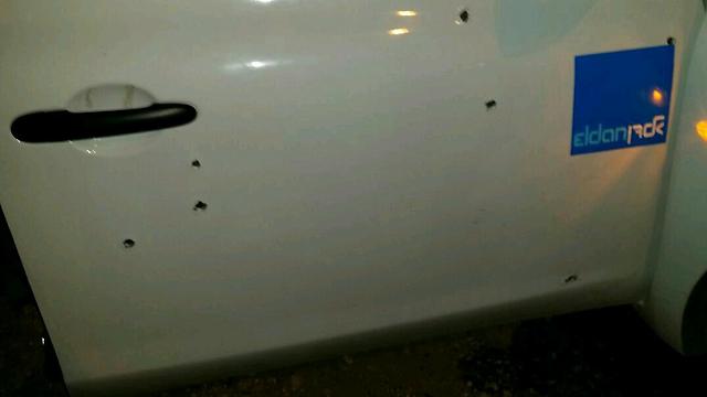 Bullet holes visible on the car door (Photo: Tazpit News Agency)