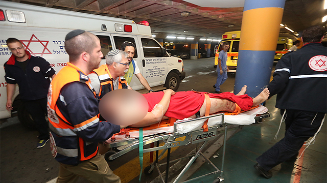 Emergency personnel evacuate the wounded (Photo: Gil Yohanan)