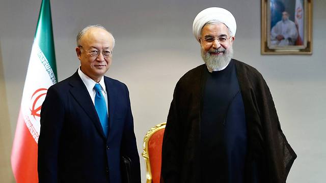 נשיא איראן רוחאני עם ראש סבא"א, יוקיה אמאנו (Photo: EPA) (Photo: EPA)