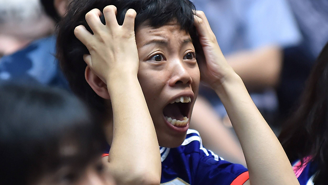 ההלם ביפן מול ההתרסקות בגמר (צילום: AFP) (צילום: AFP)