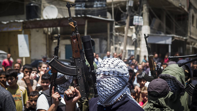 Palestinian armed militiamen (Photo: Getty) 