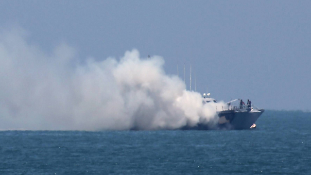 Smoke billows from the Egyptian ship (Photo: AFP)