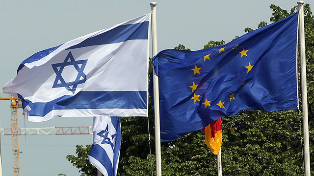 The Israeli and European Union flags in Berlin (Photo: AFP)