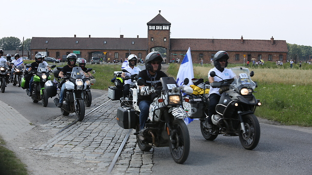 Israeli bikers riding through Auschwitz on their way to the Maccabiah games in Berlin (Photo: Yossi Aloni)