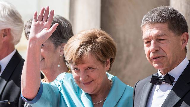 No one is interested in the suits worn by Angela Merkel’s husband  (Photo: EPA)