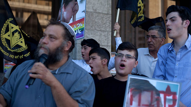 Lehava head Benzi Gopstein speaking at the organization's demonstration against this year's gay pride parade in Jerusalem. (Photo: gettyimages)