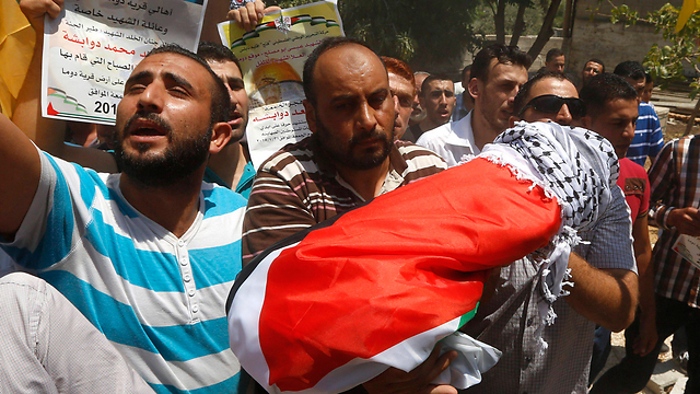 The results of Jewish jihad - an 18-month-old Palestinian is laid to rest after being burned alive by Jewish settlers (Photo: EPA) (Photo: EPA)