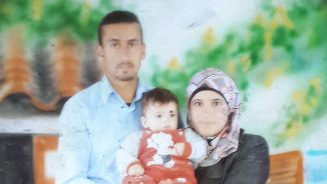 The three slain Dawabsheh family members: Father Saed, mother Reham and baby Ali (Photo: Hassan Shaalan) (Photo: Hassan Shaalan)