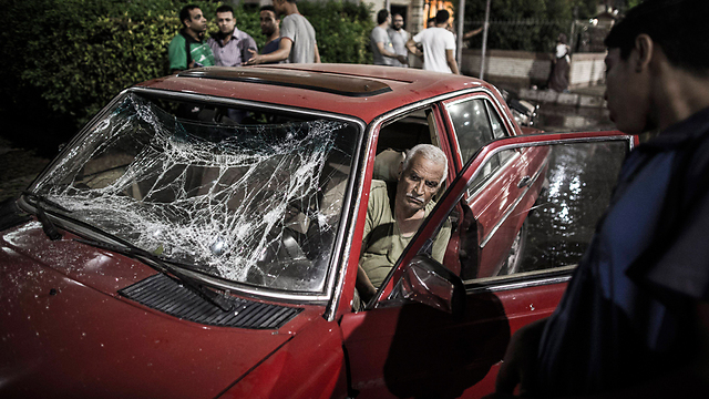 נזק למכונית בגלל הפיצוץ (צילום: AFP) (צילום: AFP)