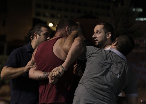 Lebanese security detain a protester (Photo: AP)
