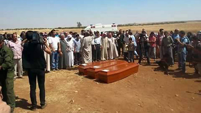 Funeral of Aylan Kurdi, his brother and mother in Kobani.  To what extent can we trust the memory or conscience of all the shocked people? (Photo: AFP)