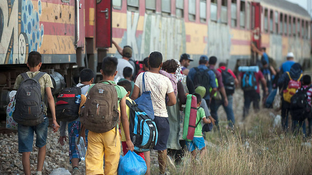 Refugees boarding a train after crossing the Greek border (Photo: AFP)