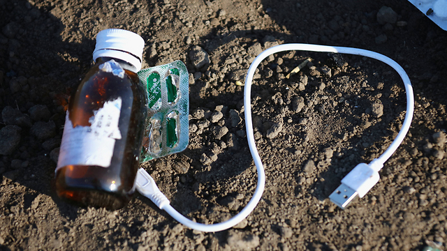 A USB cable and some medicine. Even when wandering, refugees try to charge their phones and stay connected as much as possible. (Photo: Getty Images)