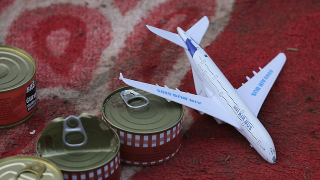 A toy plane and canned goods. (Photo: Getty Images)
