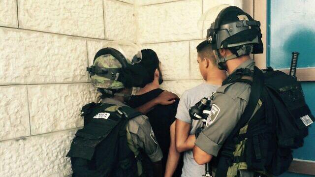 Border Police arresting minors for throwing stones in Jabel Mukaber, East Jerusalem. (Photo: Police Spokesperson's Unit)
