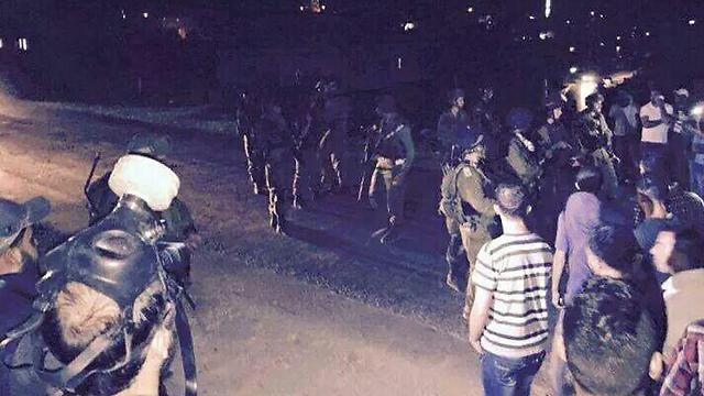Soldiers in Beit Hagai where a Palestinian died in an explosion last night.