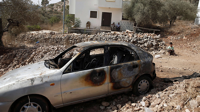 'Price tag' attack on a Palestinian car (Photo: AFP)