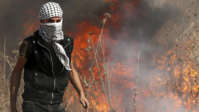 A Palestinian during Friday's riots along the Gaza border. (Photo: Reuters)