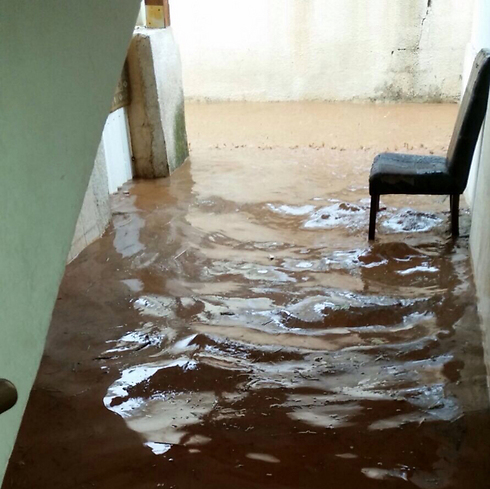 Water fills the entrance to an apartment building in Kfar Saba on Thursday. (Photo: Chagai)