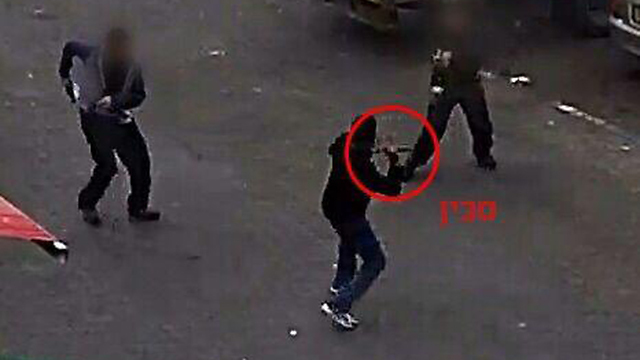 Still from a recording of a security guard shooting an attacker during an attempted attack at Damascus Gate, Jerusalem.