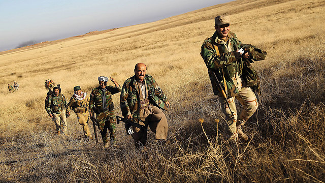 Kurdish fighters taking Sinjar. (Photo: MCT)
