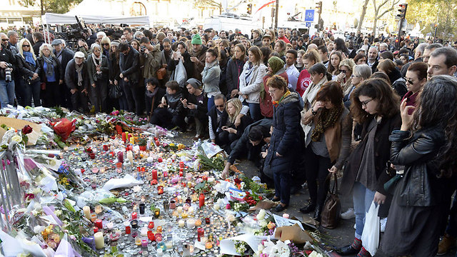 Mourners gather outside the Bataclan Theater, where the most victims died (Photo: AFP) (Photo: AFP)