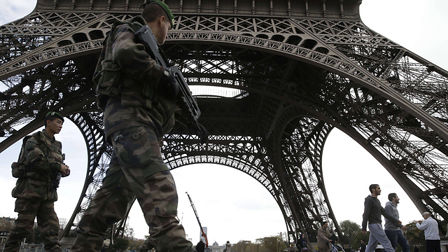 French soldiers patrolling the Eiffel Tower following the deadly attacks (Photo: AFP)