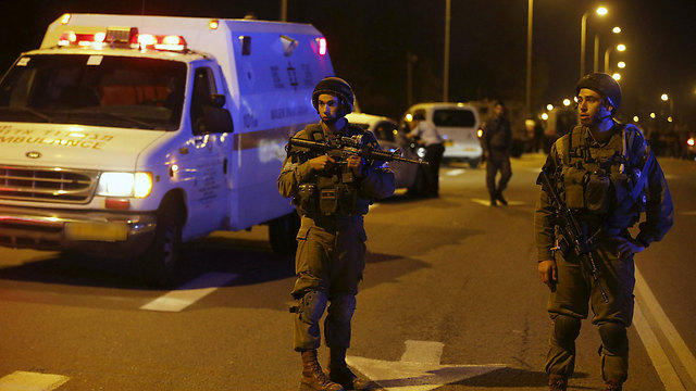 IDF troops at Gush Etzion junction on Thursday after the attack that killed 3. (Photo: Reuters)