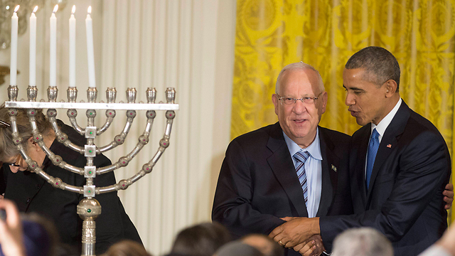 At the Hanukkah candle lighting ceremony. 'You have lit the candle for the last seven years',' Rivlin told Obama (Photo: EPA)