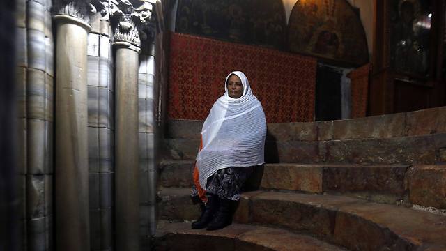 A Christian pilgrim prays in the 'Grotto' of the Church of the Nativity (Photo: Reuters)