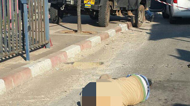 The terrorist after he was shot and neutralized (Photo: Hatzalah)