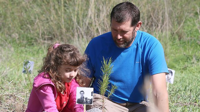 Boaz Shaham and daughter Tamar, 8, 'rehearse' the first planting