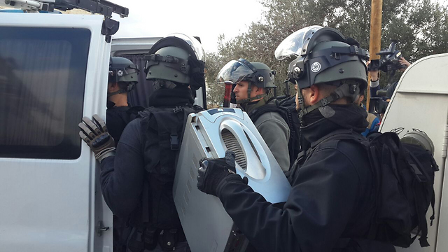 Police with the shooter's computer. (Photo: Hassan Shaalan)