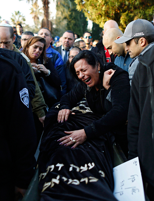 Alon Bakal's mother, Nitzah, at her son's funeral (Photo: EPA)