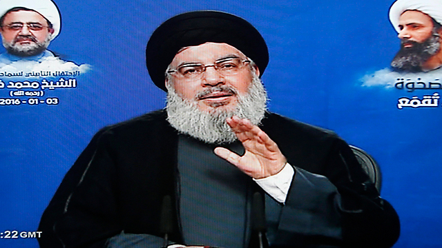 Nasrallah delivering a speech on the execution of a prominent Shi'ite cleric (Photo: EPA)