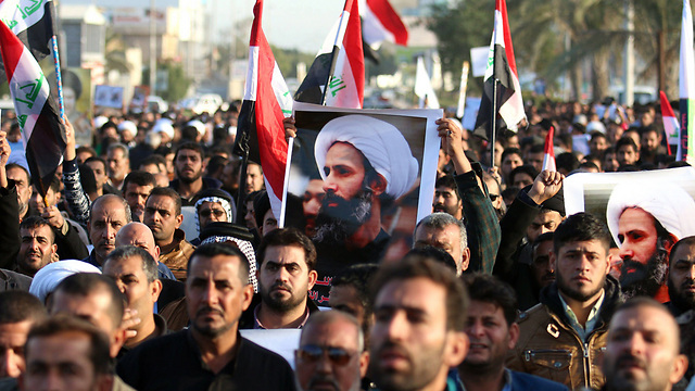 מחאה בעיראק נגד הוצאתו להורג של המטיף השיעי א-נימר על ידי סעודיה (צילום: AFP) (צילום: AFP)