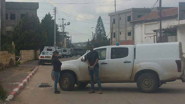 Police block a road in Arara during search for Melhem's father