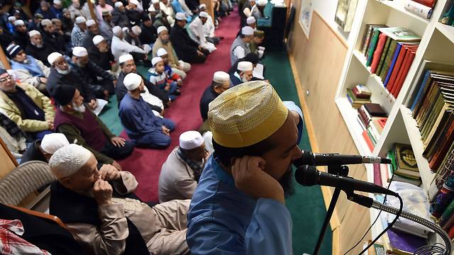 A Muslim man delivers "Azan" - the call to prayer - over loudspeakers before their weekly Friday noon special prayer at the Al-Islah Islamic Center Mosque in Hamtramck, Michigan (Photo: AFP)