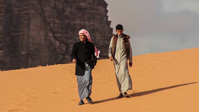 Jacir Eid Al-Hwietat, right, and his cousin, Hussein Salameh al-Sweilhiyeen, pose for a photo in Wadi Rum, a scenic desert area of southern Jordan (Photo: AP)