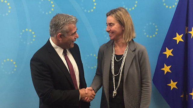 Yesh Atid leader Yair Lapid meeting with EU foreign policy chief Federica Mogherini.