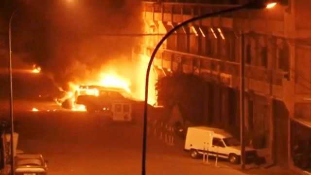 Fire outside Burkina Faso hotel (Photo: Reuters)